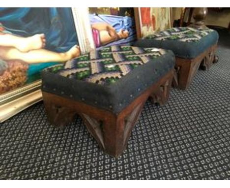A pair of late 19th Century oak framed foot stools, with tapestry upholstery.