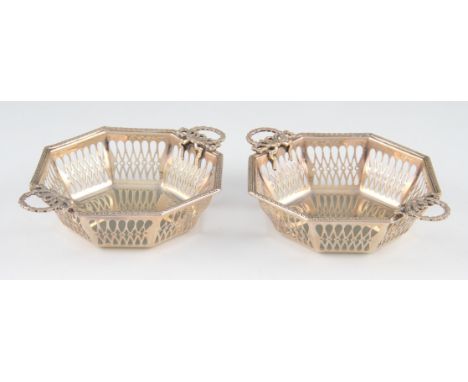 A pair of early 20th Century Goldsmiths & Silversmiths silver pierced dishes, the octagonal form featuring repeat pierced des