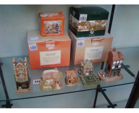 Five Lilliput Lane collectible sculptures, four boxed with deeds to include: Jeweller L2108, The Coach and Horses L2112, Mont