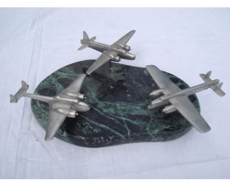 Three model wartime aircraft by D.P Carter.  On marble base with rotation, wingspan of each aircraft: 14cm, 13.5cm and 13.5cm