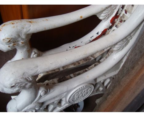 A wooden seated and backed white painted cast iron framed bench with lions heads, bearing the words ''Town Eastham 1900 D'Ent