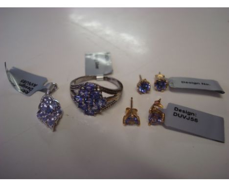 A tanzanite pendant, stamped 925; a tanzanite ring, marked 925, size R1/2; a pair of 9k gold tanzanite earrings and another p