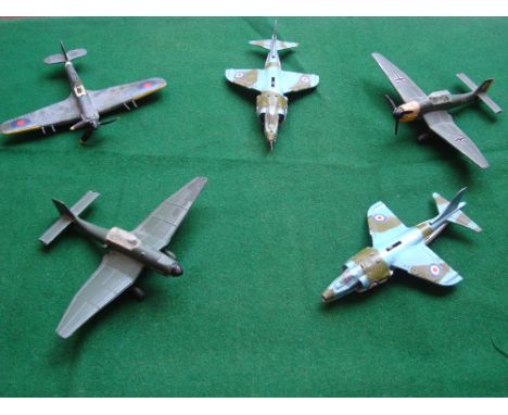 Two Dinky Toys 'Harrier' jump jet planes (model 722), with landing gear mechanism together with a Dinky Toys 'Junkers' aircra