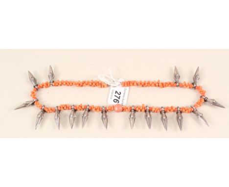 An unusual coral necklace with white metal 'dagger' shaped drops