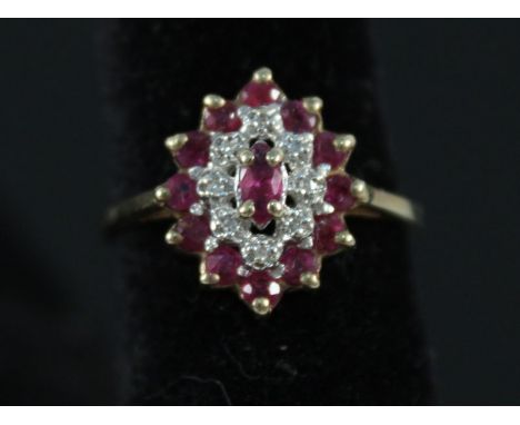 A 9ct gold ruby and diamond cluster ring, size P