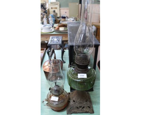 A green glass iron base oil lamp plus one other