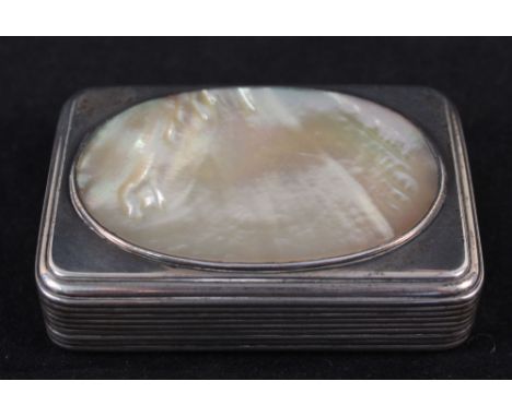 A large Georgian silver table snuff box with oval mother of pearl panel