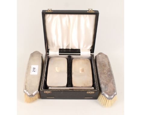 A cased engine turned silver brush set plus two other brushes