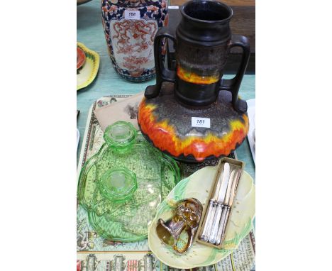 A German orange and black vase, Art Deco green glass part trinket set, silver handled tea knives etc