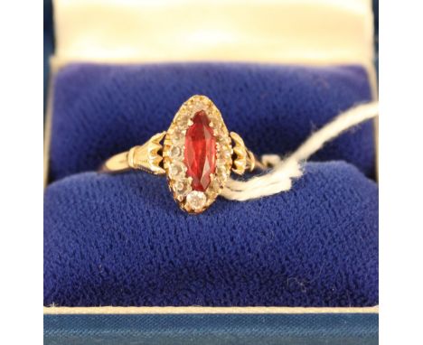 A 9ct gold ring set with red and white stones, size S