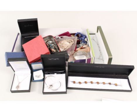 A collection of silver jewellery including amber set bracelet, snake form bangle, stone set pendants, various rings and costu