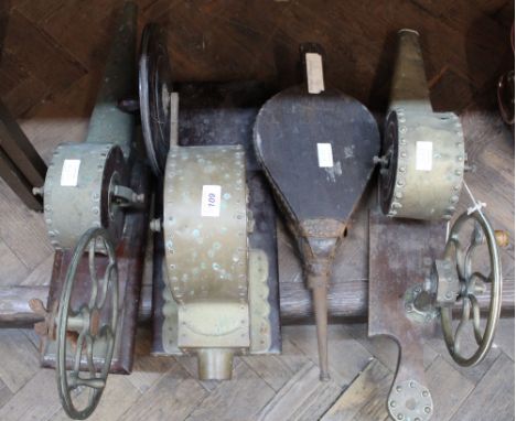 Three Victorian brass and mahogany hand cranked fire lighting blowers plus a pair of bellows