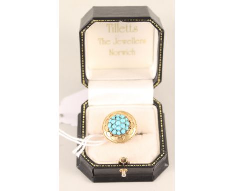 An unmarked large ring set with turquoise cluster to centre, rope style decoration to outer, size M