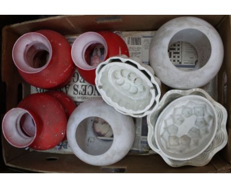 Four Victorian china jelly moulds plus various oil lamp shades