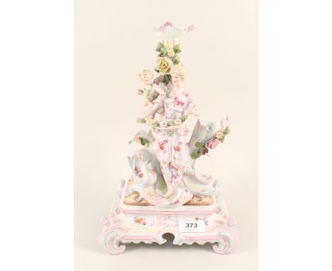 A 19th Century continental porcelain figure and cherub candlestick (as found)
