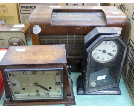 Two mantel clocks plus two mains radios, these items are sold as a collectors item only and have not been subject to an elect