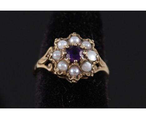 A 9ct gold ring set with pearls and single amethyst, size J