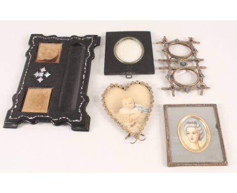 A Victorian papier mache inkstand, portrait miniature and various photo frames