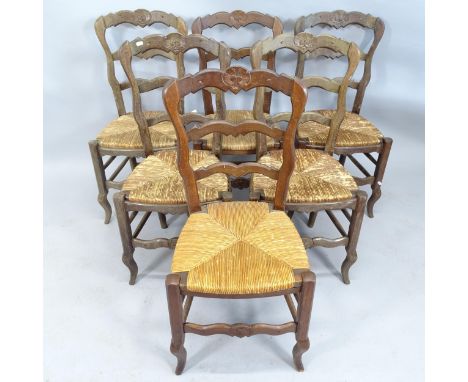 A set of 6 French rush-seated ladder back dining chairs. 