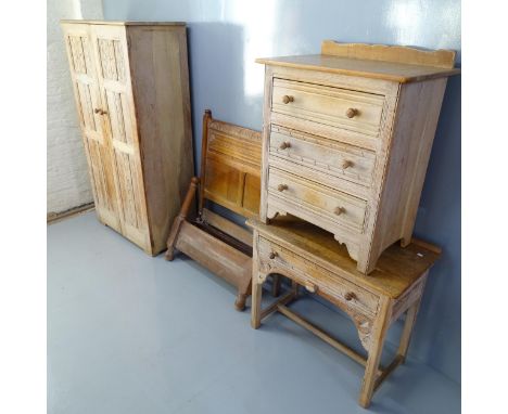 A mid-century Ercol limed oak four-piece bedroom suite comprising a single bed, two door wardrobe (94x176x52cm), a chest of t