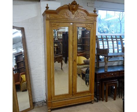 A French walnut two door wardrobe with shelf fitted interior.117x236x53cm 