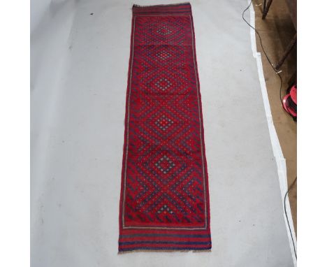 A red ground Maimana Kilim runner. 240x65cm 