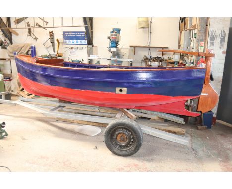 An open motor launch to be sold on behalf of The North East Maritime Trust. The motor launch is of larch and oak framed const