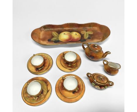A miniature Coalport tea service, decorated with fruit