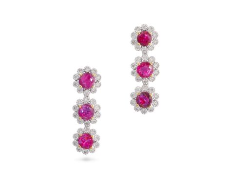 A PAIR OF RUBY AND DIAMOND CLUSTER DROP EARRINGS in 18ct white and yellow gold, each set with three round cut rubies in clust