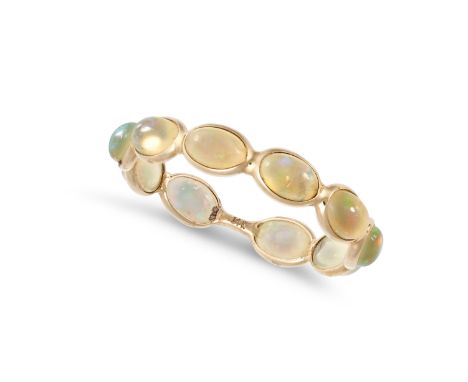 AN OPAL ETERNITY RING in&nbsp;14ct yellow gold, set with a row of oval cabochon cut opals, stamped 14k, size O / 7.25, 0.9g.&