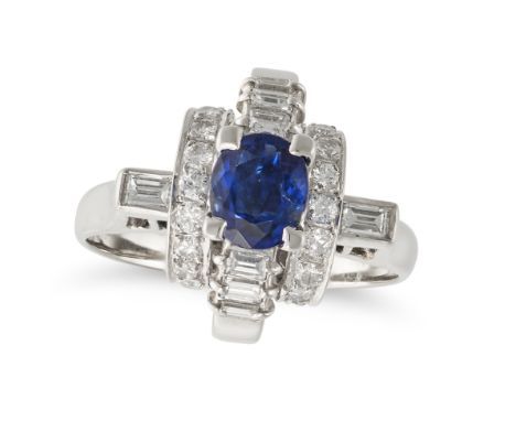 A SAPPHIRE AND DIAMOND DRESS RING in platinum, set with an oval cut sapphire of 0.91 carats on a stylised mount set with roun