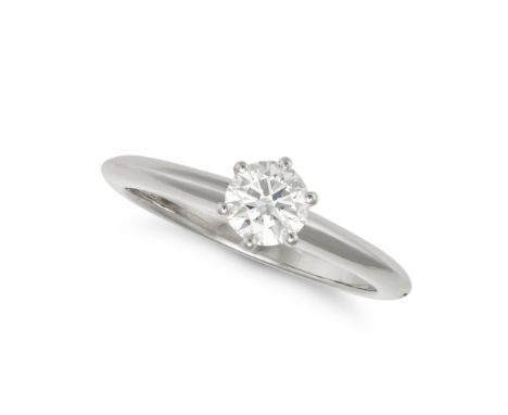 TIFFANY &amp; CO., A SOLITAIRE DIAMOND ENGAGEMENT RING in platinum, set with a round brilliant cut diamond of 0.45 carats, si