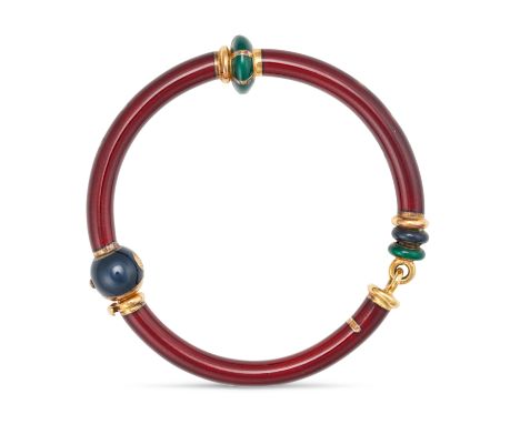 LA NOUVELLE BAGUE, AN ENAMEL BANGLE in 18ct yellow gold, comprising three sections decorated with dark red enamel, accented b