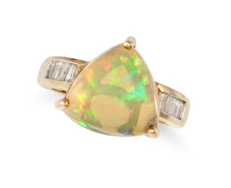 AN OPAL AND DIAMOND RING in 9ct yellow gold, set with a triangular cabochon opal, the band set with tapered baguette cut diam