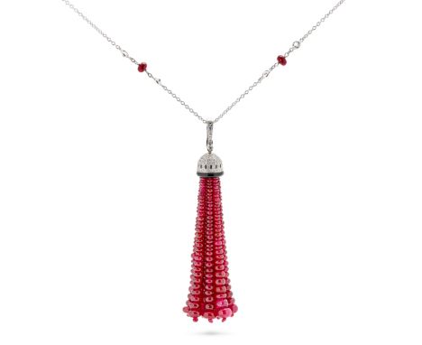 A RUBY, DIAMOND, ONYX AND WHITE TOPAZ TASSEL PENDANT NECKLACE in 18ct white gold, the tassel formed of twelve rows of polishe