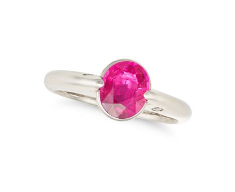 A RUBY AND DIAMOND RING in platinum, set with an oval cut ruby of 1.07 carats, the shoulders accented by two round brilliant 