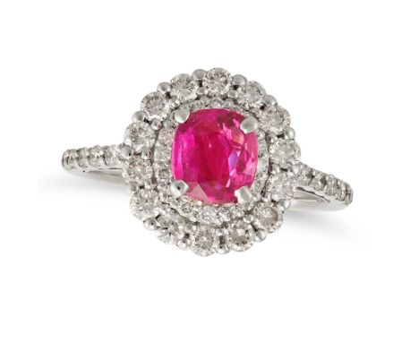 A RUBY AND DIAMOND CLUSTER RING in platinum, set with a cushion cut ruby of 1.05 carats in a double cluster of round brillian