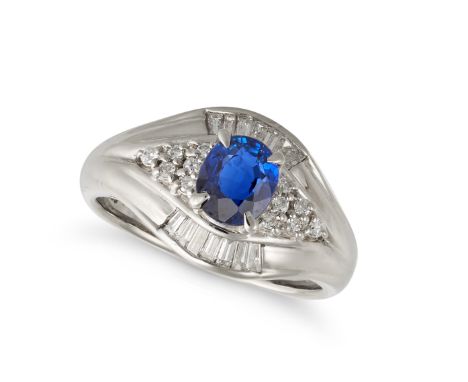 A SAPPHIRE AND DIAMOND RING in platinum, the tapering band set with an oval cut sapphire of 1.10 carats accented by round bri