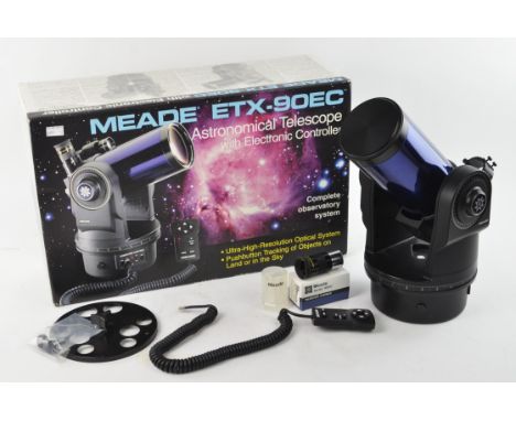 A Meade ETX-90EC Astronomical Telescope with electronic controller, boxed, and a tripod.