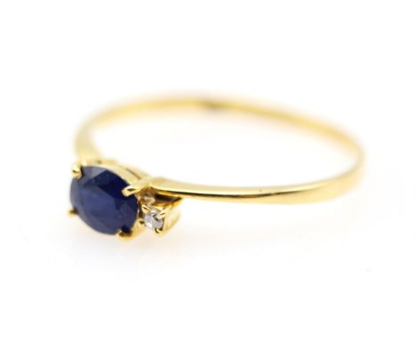 Sapphire and diamond ring, set with an oval cut sapphire, estimated weight 0.46 carats and a round brilliant cut diamond,  ri