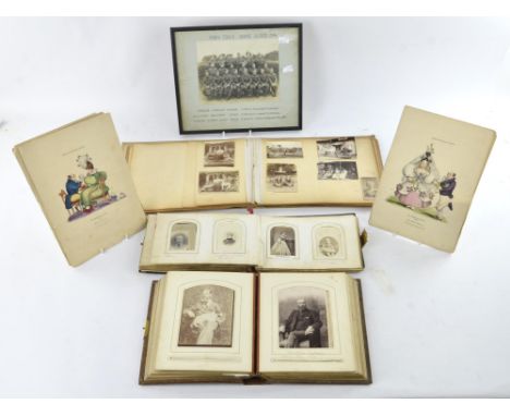 A quantity of Victorian black and white portrait photographs contained in a leather and brass bound album, another similar al