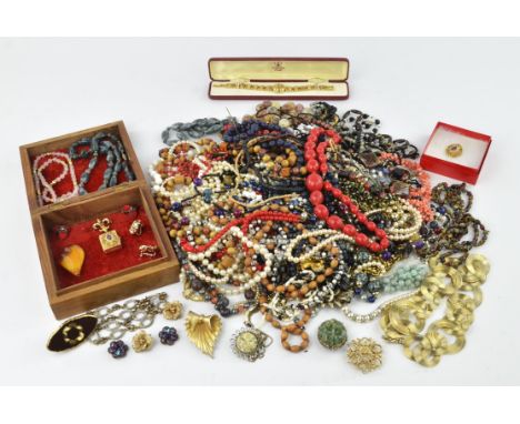 A large group of coloured beaded and faux pearl necklaces, including a moss agate tumbled bead necklace and a couple of pairs