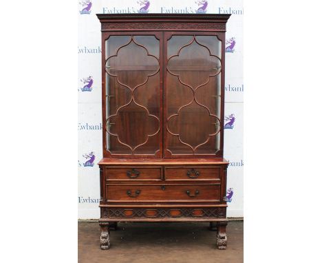 A George III style mahogany display cabinet, early 20th century, in the Chippendale taste, in two parts, the quatrefoil glaze