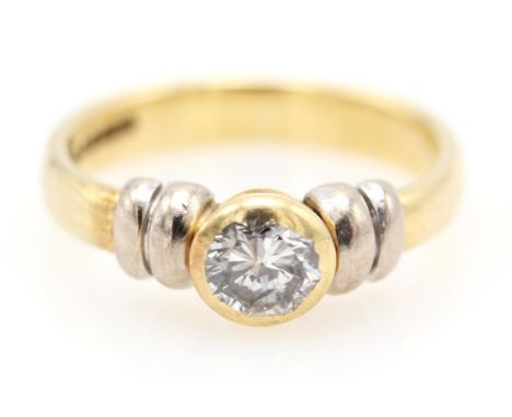 Bi coloured diamond ring, set with a brilliant cut diamond 0.35 carats in a rub over setting, hallmarked 18 ct, ring size I.C