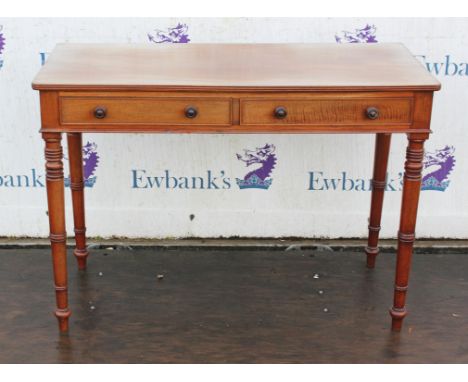 A George IV mahogany dressing table, the top with a reeded edge above two drawers, on ring turned tapered legs, H 74cm, W 106