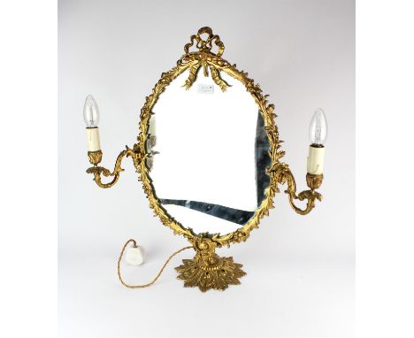 A gilt metal oval dressing mirror, 20th Century, 61cm high Condition Report:  Please note the plug has been removed from this