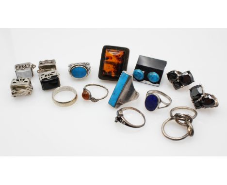 A group of silver rings and earrings, including a pair of silver rectangular moonstone earrings with clip back fittings, a mo