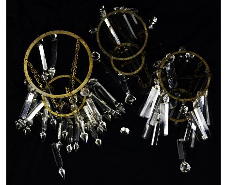 A pair of early 20th century bag chandeliers hung with cut glass prisms (15.5cm diameter) and one larger, similar bag chandel