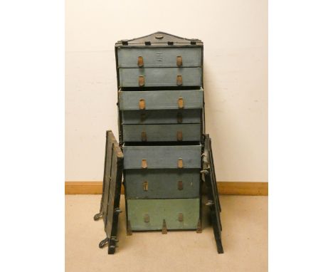A large black late Victorian iron bound fitted travelling trunk with eight interior drawers by Innovation of New York  