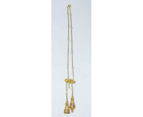 A Victorian pearl and enamel drop necklace set in an unmarked yellow metal